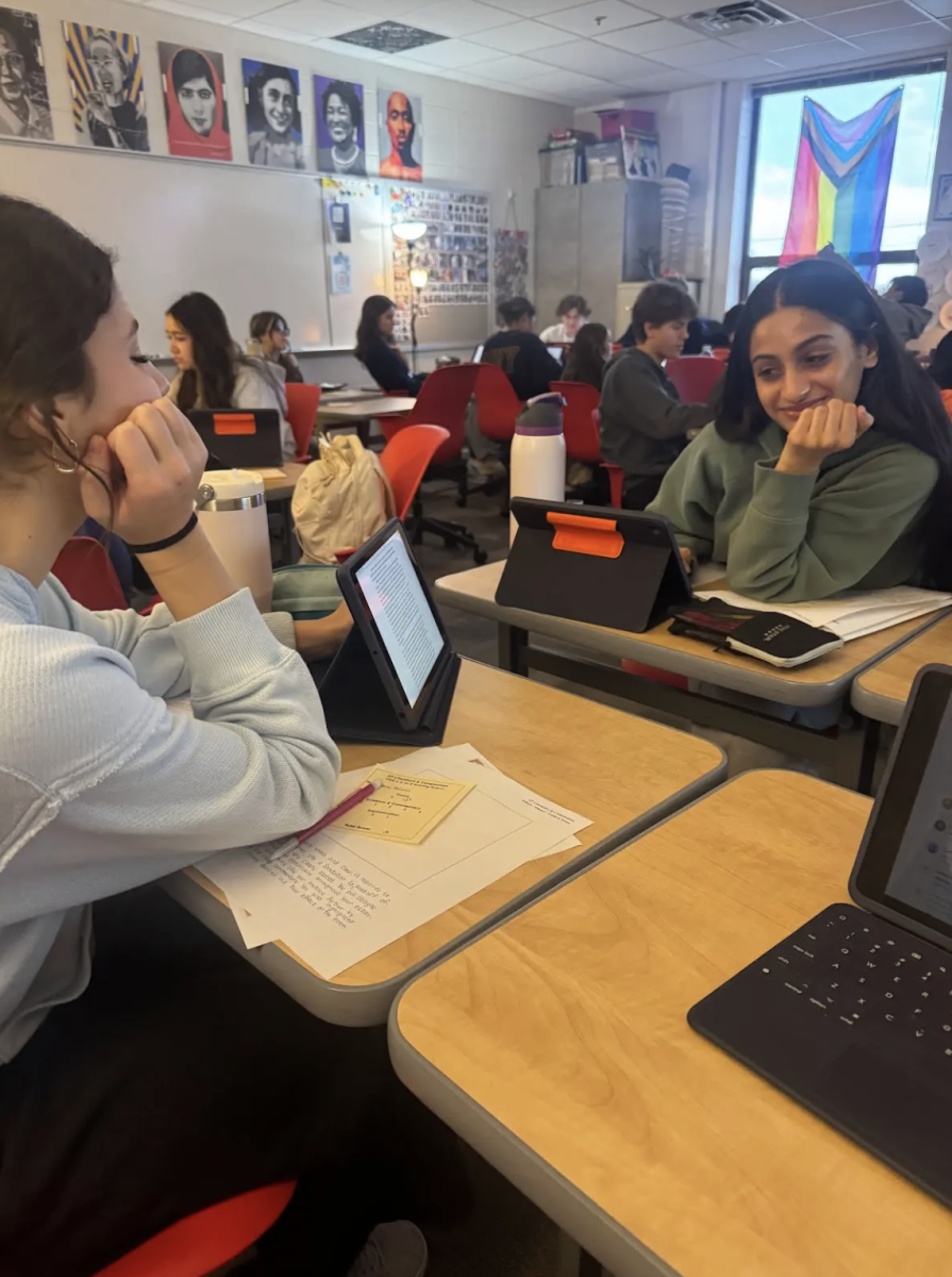 Seniors Anna DeLuna and Prabhleen Kaur deliberate in a pass and grade for a mock timed writing in Josh Surface’s 1st period AP Literature class.  As May approaches, the students are preparing for the timed writings they will have to do on the AP test. “I really like Surface makes preparing for the AP test fun and collaborative. It is more enjoyable and fulfilling when we get to deliberate with other students," DeLuna said.